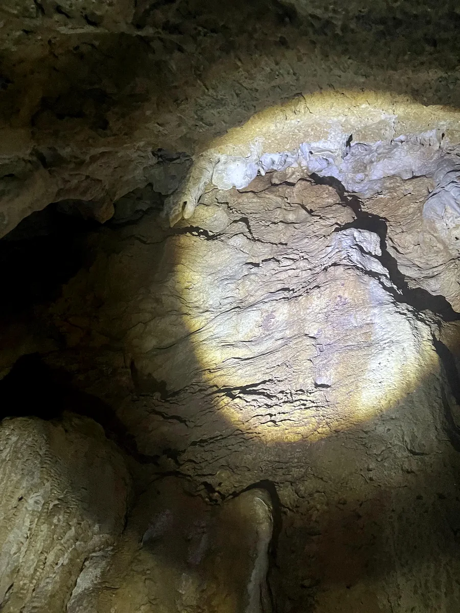 Cave wall with flowstone-like secondary carbonate